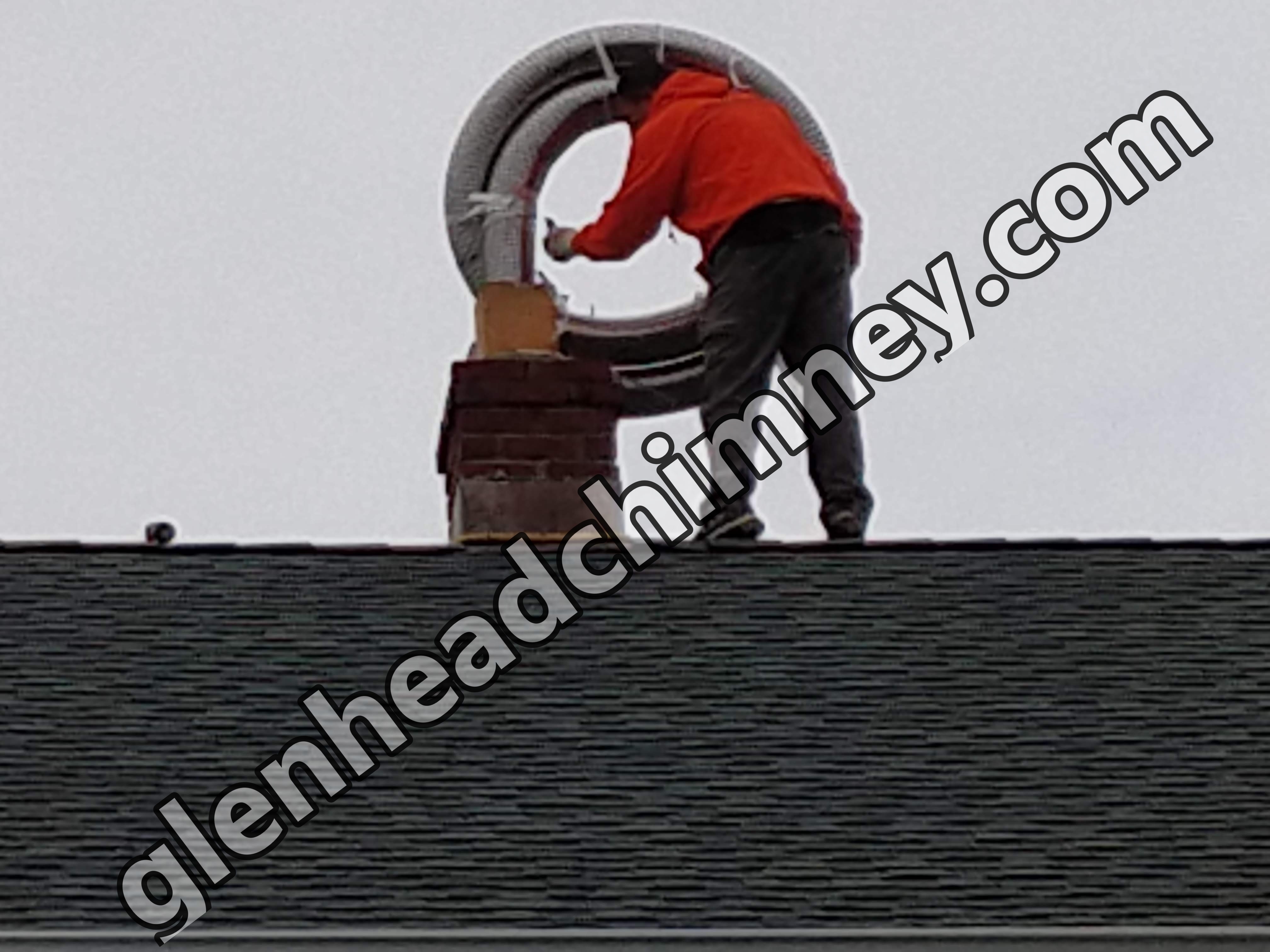 Flexible stainless chimney liner being installed in Glen Head, New York